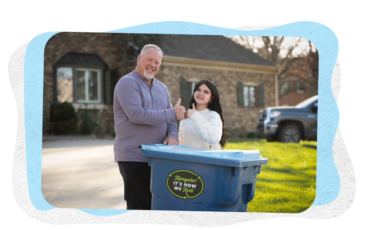 Man recycling with Granddaughter